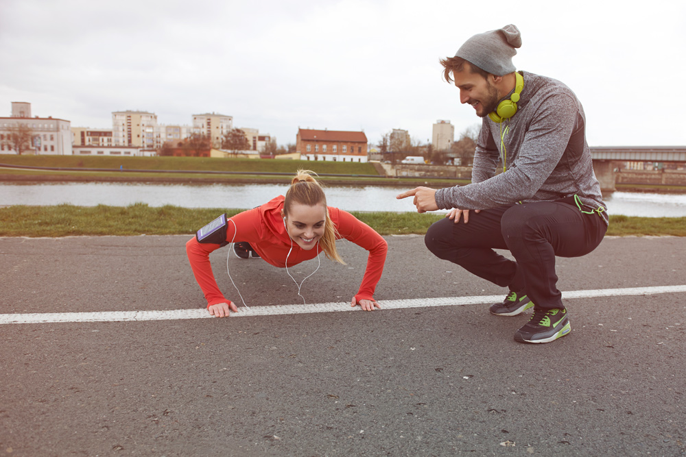 Girl doing pushups listening to music